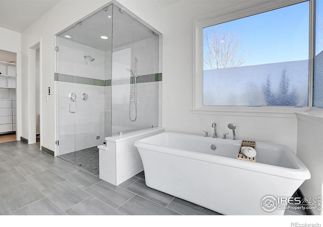 11251 Lookout Dr, Longmont, CO 80504 - full bathroom with a shower stall, a freestanding tub, and recessed lighting