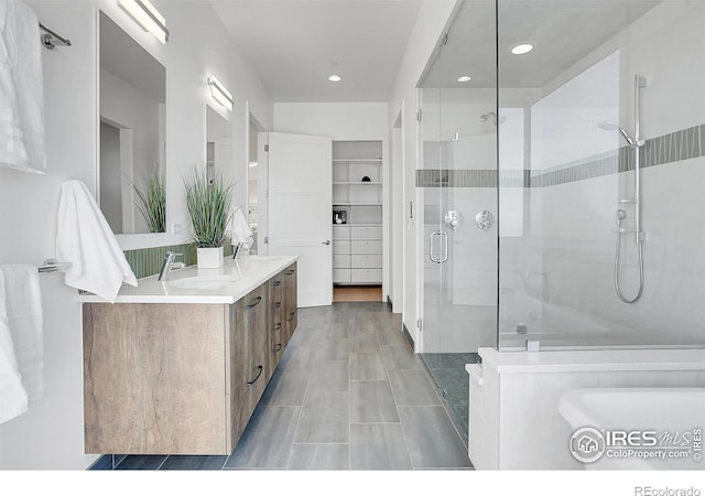 11251 Lookout Dr, Longmont, CO 80504 - full bath featuring a shower stall, recessed lighting, and double vanity