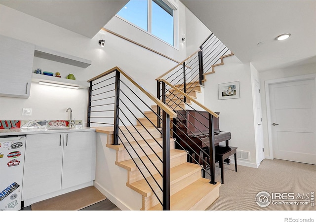 11251 Lookout Dr, Longmont, CO 80504 - staircase featuring baseboards and carpet flooring