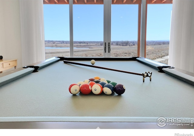 11251 Lookout Dr, Longmont, CO 80504 - recreation room featuring pool table, healthy amount of natural light, and carpet flooring