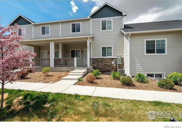 4355 24th Street Rd Unit 803, Greeley, CO 80634 - view of front of property with board and batten siding and a porch