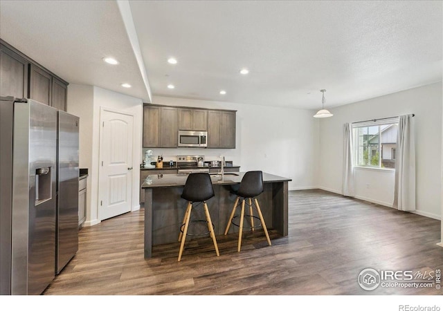 4355 24th Street Rd Unit 803, Greeley, CO 80634 - kitchen featuring dark wood-type flooring, recessed lighting, appliances with stainless steel finishes, and dark brown cabinets