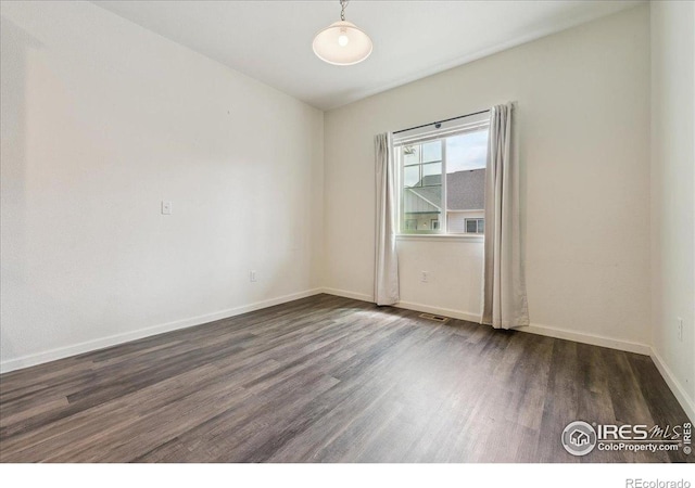 4355 24th Street Rd Unit 803, Greeley, CO 80634 - unfurnished room featuring baseboards, wood finished floors, and visible vents