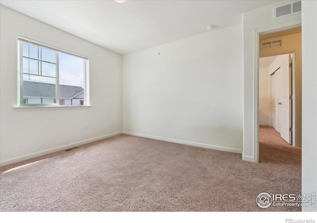 4355 24th Street Rd Unit 803, Greeley, CO 80634 - carpeted spare room featuring baseboards and visible vents