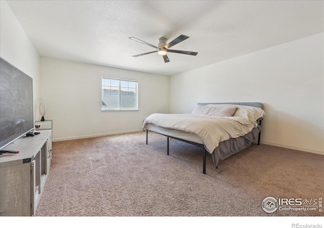4355 24th Street Rd Unit 803, Greeley, CO 80634 - bedroom featuring baseboards, a ceiling fan, and light colored carpet