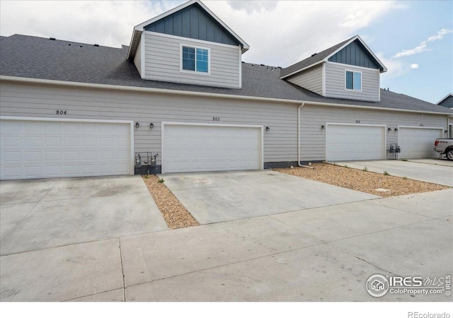 4355 24th Street Rd Unit 803, Greeley, CO 80634 - multi unit property featuring a shingled roof, board and batten siding, and driveway
