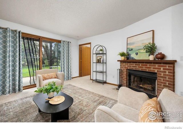 1231 W Swallow Rd Unit 314, Fort Collins, CO 80526 - living area with baseboards, carpet flooring, a textured ceiling, and a brick fireplace