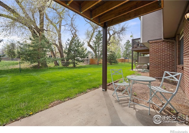 1231 W Swallow Rd Unit 314, Fort Collins, CO 80526 - view of patio featuring a fenced backyard