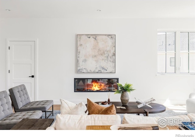 914 Eldorado Ln, Louisville, CO 80027 - living area with a glass covered fireplace, baseboards, recessed lighting, and wood finished floors