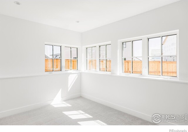 914 Eldorado Ln, Louisville, CO 80027 - carpeted empty room with baseboards and a wealth of natural light