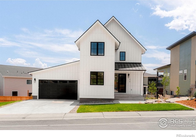 914 Eldorado Ln, Louisville, CO 80027 - modern farmhouse with metal roof, a standing seam roof, board and batten siding, concrete driveway, and an attached garage