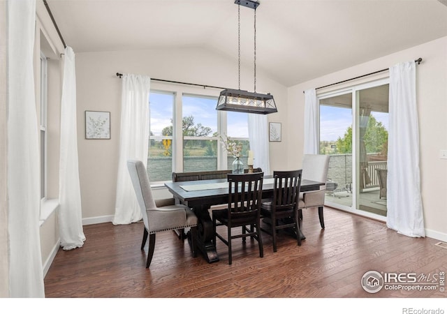 5845 Shadow Creek Ct, Windsor, CO 80528 - dining area featuring lofted ceiling, healthy amount of natural light, dark wood-style flooring, and baseboards