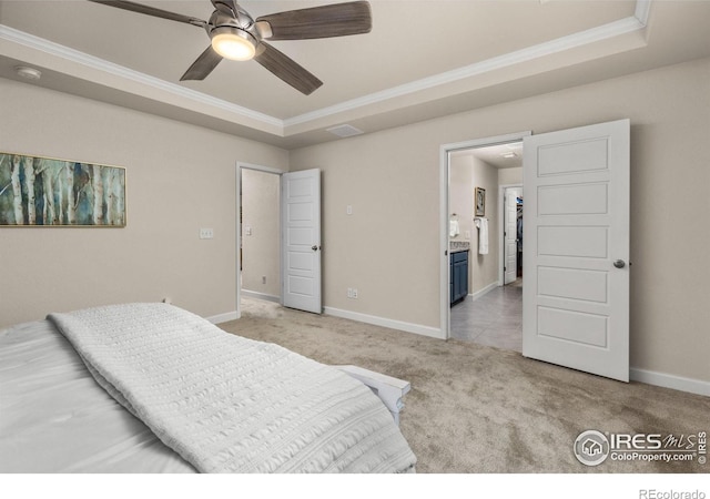5845 Shadow Creek Ct, Windsor, CO 80528 - bedroom featuring light carpet, crown molding, a tray ceiling, and baseboards