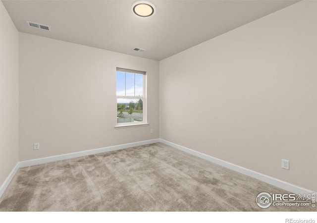 5845 Shadow Creek Ct, Windsor, CO 80528 - spare room featuring carpet flooring and baseboards