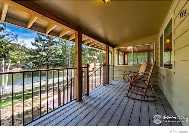 565 Hemlock Dr, Lyons, CO 80540 - wooden terrace featuring a water view