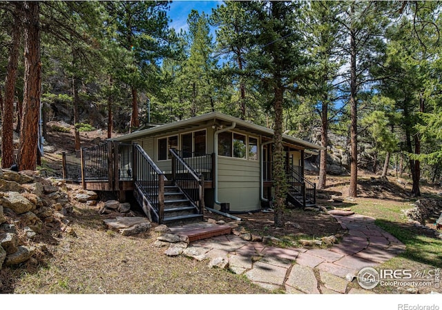565 Hemlock Dr, Lyons, CO 80540 - view of front of property featuring a sunroom and stairway