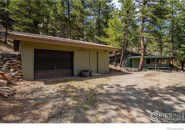 565 Hemlock Dr, Lyons, CO 80540 - garage featuring covered porch and driveway