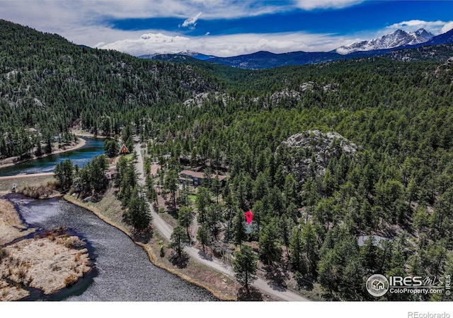 565 Hemlock Dr, Lyons, CO 80540 - drone / aerial view featuring a water and mountain view and a wooded view