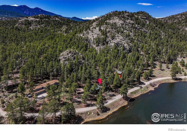 565 Hemlock Dr, Lyons, CO 80540 - birds eye view of property featuring a wooded view and a water and mountain view