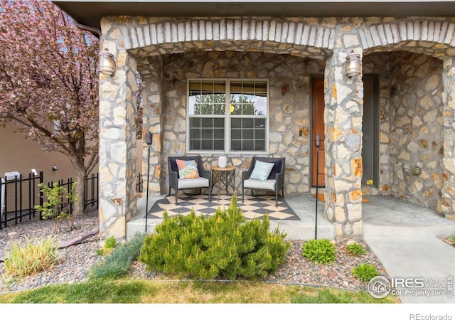 1992 Vineyard Dr, Windsor, CO 80550 - view of patio / terrace featuring fence and covered porch