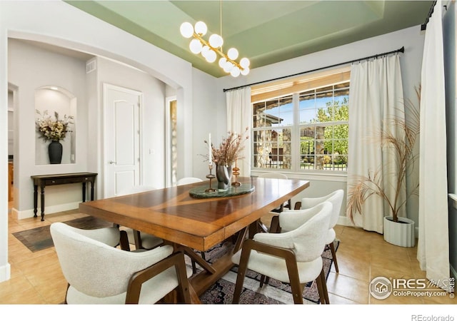 1992 Vineyard Dr, Windsor, CO 80550 - dining space with baseboards, arched walkways, light tile patterned floors, and visible vents