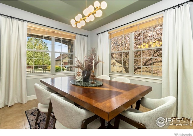 1992 Vineyard Dr, Windsor, CO 80550 - dining room featuring baseboards, a chandelier, and light tile patterned floors