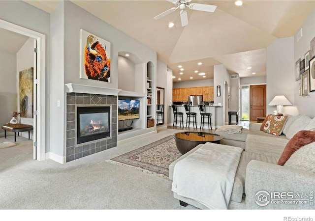 1992 Vineyard Dr, Windsor, CO 80550 - living area with carpet floors, ceiling fan, recessed lighting, and a tile fireplace
