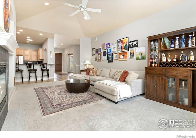 1992 Vineyard Dr, Windsor, CO 80550 - living room featuring arched walkways, a ceiling fan, recessed lighting, and light colored carpet