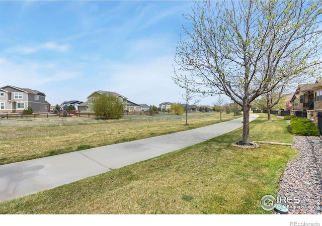 1992 Vineyard Dr, Windsor, CO 80550 - view of home's community with a residential view, fence, and a yard