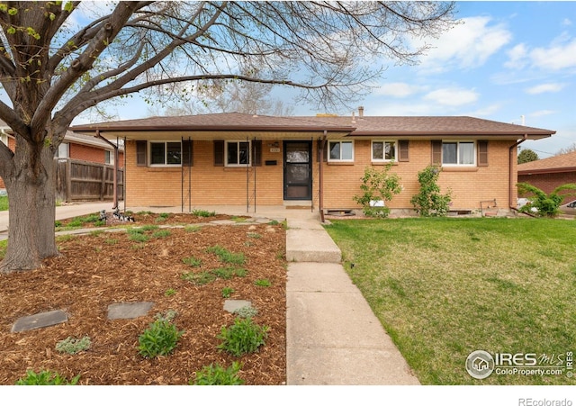 9261 Julian Way, Westminster, CO 80031 - single story home featuring fence, a front lawn, and brick siding