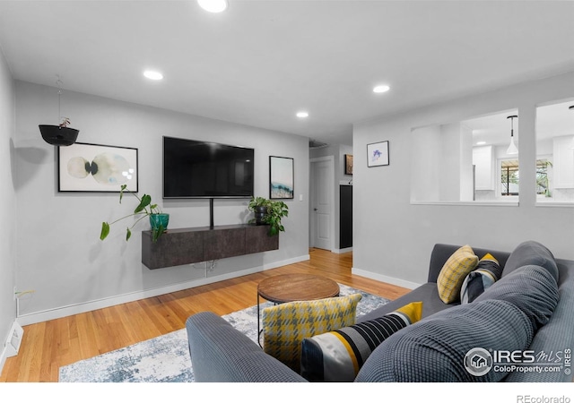9261 Julian Way, Westminster, CO 80031 - living area with baseboards, recessed lighting, and wood finished floors