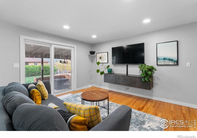 9261 Julian Way, Westminster, CO 80031 - living room with baseboards, recessed lighting, wood finished floors, and visible vents