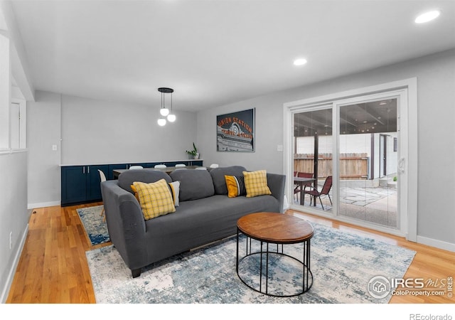 9261 Julian Way, Westminster, CO 80031 - living room with light wood-style floors, baseboards, and recessed lighting