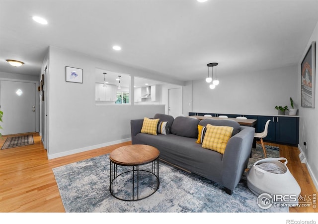 9261 Julian Way, Westminster, CO 80031 - living room featuring recessed lighting, baseboards, and wood finished floors