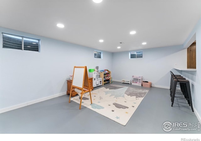 9261 Julian Way, Westminster, CO 80031 - playroom featuring baseboards, recessed lighting, and concrete flooring