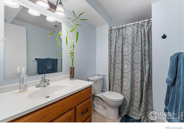 9261 Julian Way, Westminster, CO 80031 - bathroom featuring vanity, tile patterned flooring, a shower with curtain, and toilet