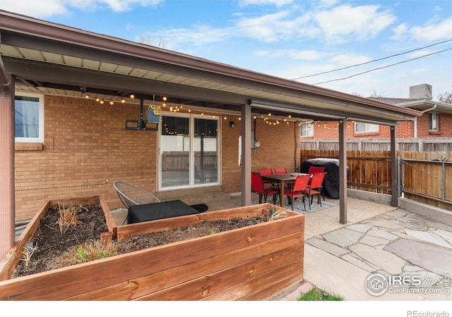 9261 Julian Way, Westminster, CO 80031 - view of patio featuring fence and outdoor dining area
