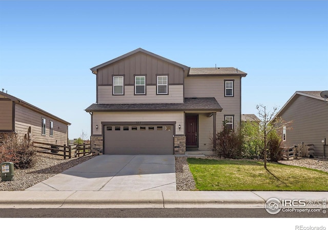 357 Chipman Dr, Windsor, CO 80550 - traditional-style house featuring board and batten siding, fence, a front lawn, concrete driveway, and an attached garage