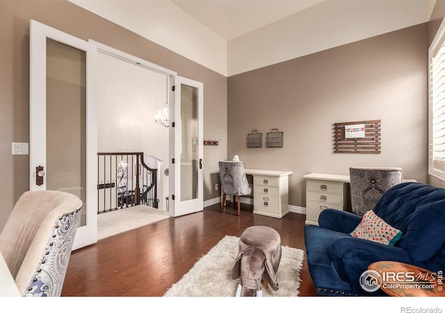 office space featuring baseboards and wood finished floors