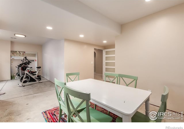 dining area featuring recessed lighting and concrete floors