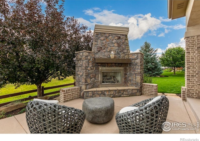 view of patio / terrace with an outdoor stone fireplace