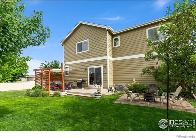 3803 Peach St, Wellington, CO 80549 - back of property featuring a fire pit, a patio area, a deck, and a pergola