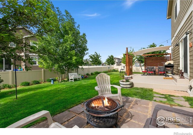 3803 Peach St, Wellington, CO 80549 - view of patio featuring a fire pit