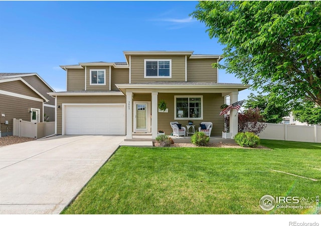 3803 Peach St, Wellington, CO 80549 - traditional home featuring covered porch, concrete driveway, and an attached garage
