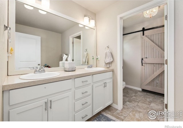 3803 Peach St, Wellington, CO 80549 - full bath with toilet, double vanity, and baseboards