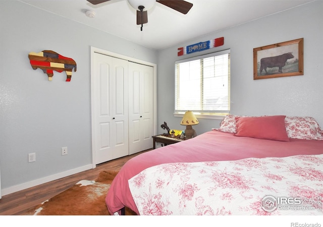 bedroom with a closet, a ceiling fan, baseboards, and wood finished floors