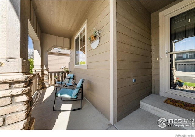 view of patio featuring a porch