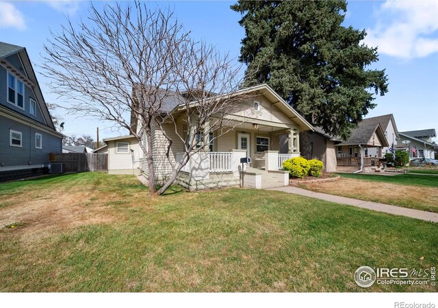 405 Maple St, Fort Morgan, CO 80701 - bungalow-style home with a porch