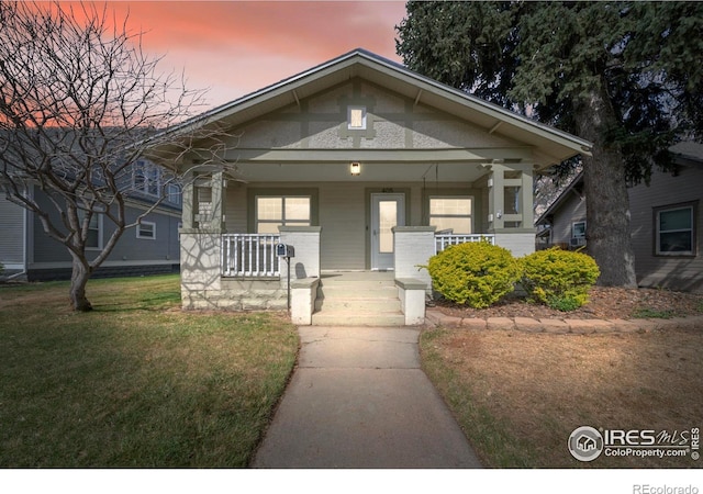 405 Maple St, Fort Morgan, CO 80701 - view of front of property featuring a porch and a yard