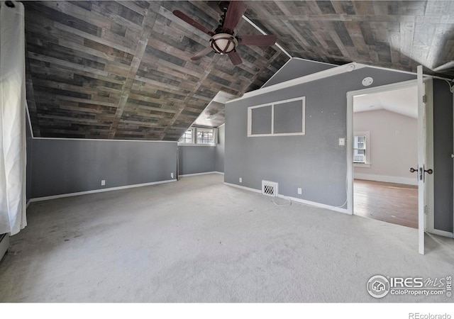 405 Maple St, Fort Morgan, CO 80701 - additional living space featuring a ceiling fan, baseboards, vaulted ceiling, and carpet
